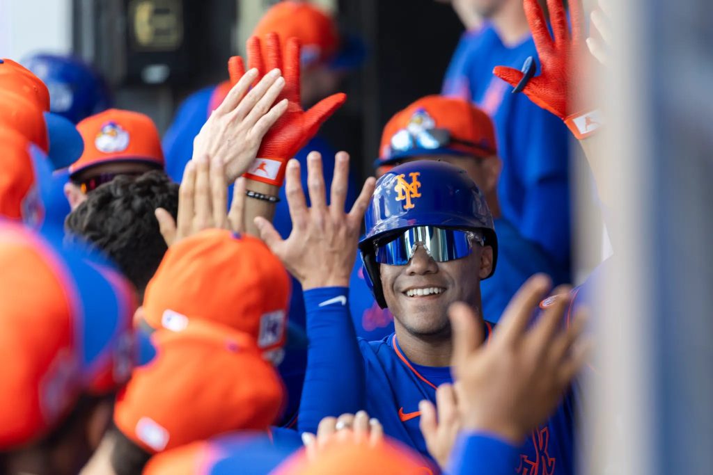 Juan Soto celebrates hitting a homerun with his team mates
